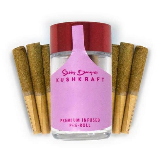 Close-up of KushKraft 6 Pack Infused Sticky Banger Pre-Rolls, featuring six 0.5g sativa joints coated in kief, showcasing 24K Gold bud and THC distillate.
