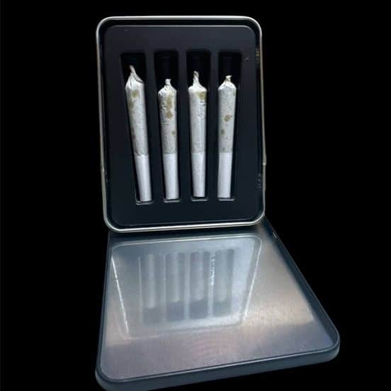 Close-up of Starfighter 4x0.5g Infused Prerolls Indica, featuring four expertly rolled 0.5g joints with a glossy shatter infusion, neatly packed.